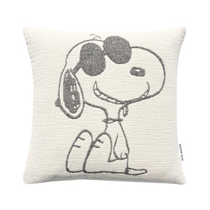 Decorative pillow with a peanuts character holding a tennis racket on a white background