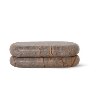 Two stacked stone-like objects on a white background