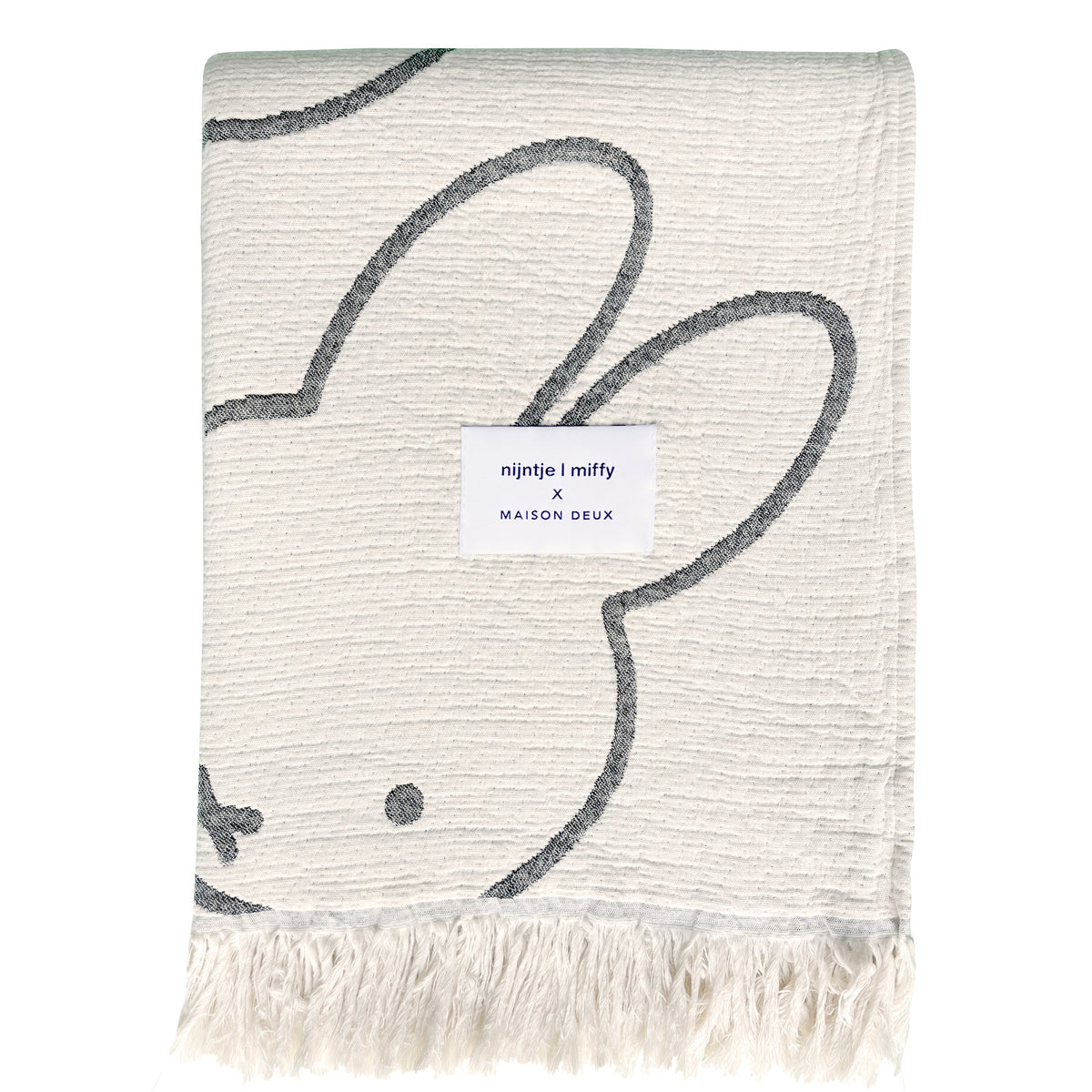 Miffy Cotton Blanket Black, jacquard-woven 100% cotton with fringed short sides and all-over Miffy print.