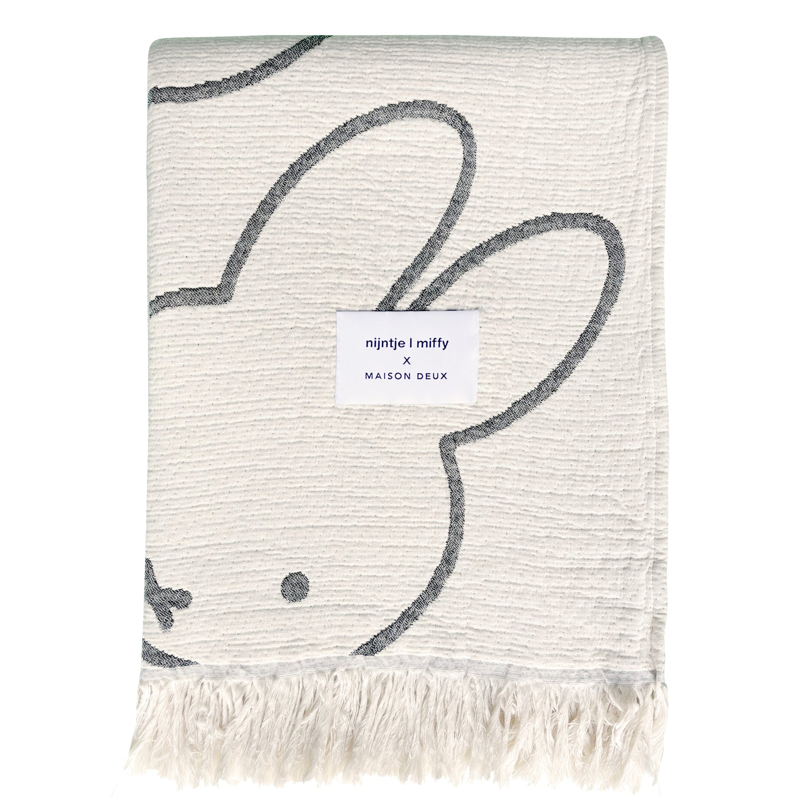 Miffy Cotton Blanket Black, jacquard-woven 100% cotton with fringed short sides and all-over Miffy print.